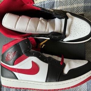 Air Jordan 1 Mid. Size 11.5. Comes with black and red laces. Great condition.